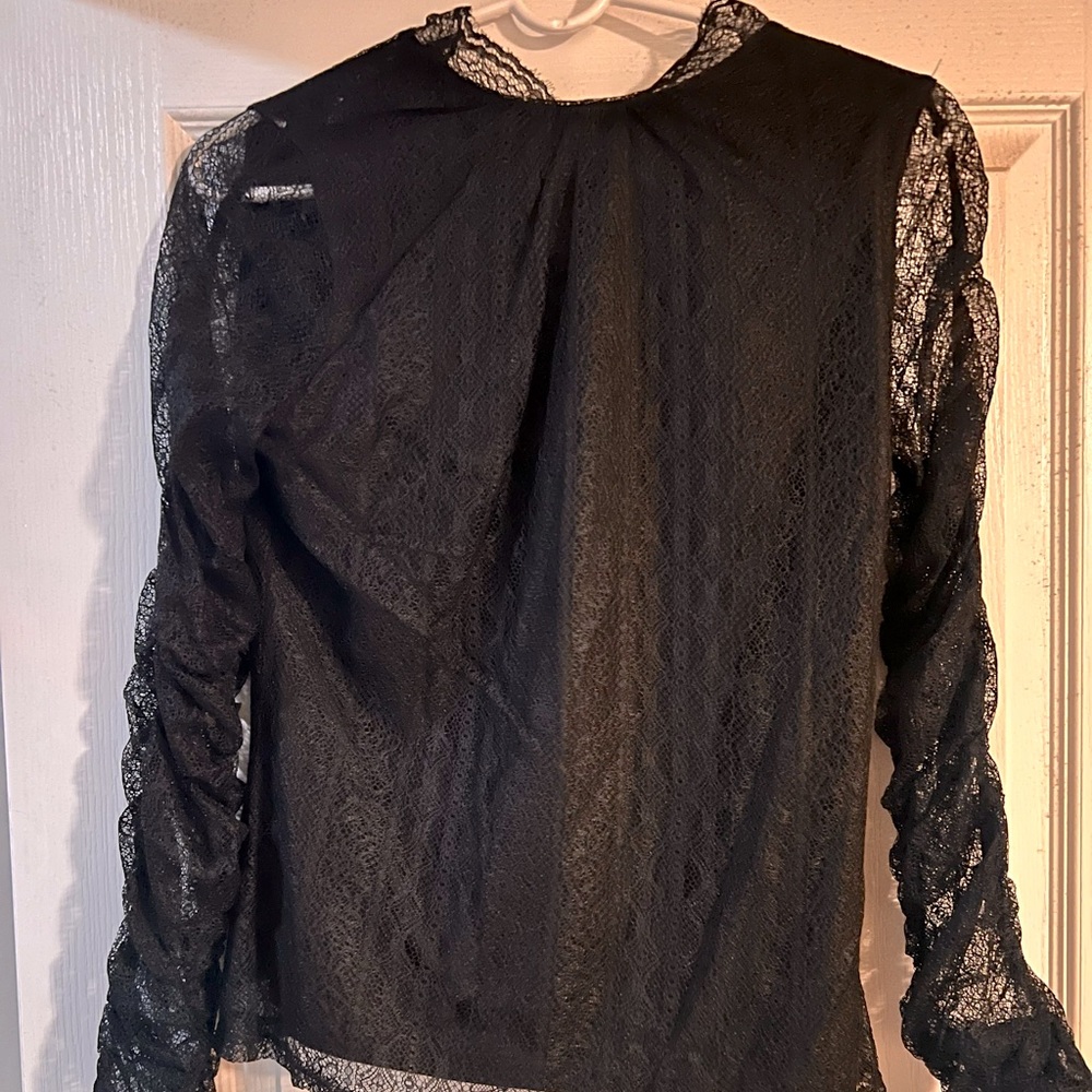 Express top with lace sleeves. Never worn
